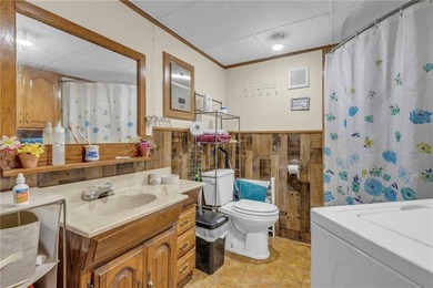 Enjoy lakeside living with this charming and move-in ready cabin - photo 11
