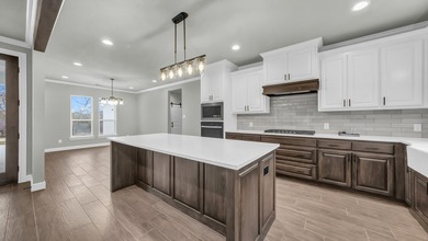 This proposed Ava plan features 3 beds 2 full baths, a - photo 12