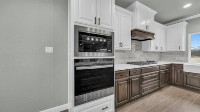 This proposed Ava plan features 3 beds 2 full baths, a - photo 15