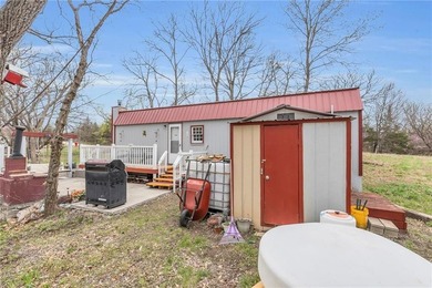 Enjoy lakeside living with this charming and move-in ready cabin - photo 20