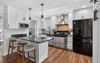 Welcome to this beautifully maintained waterfront ranch in the