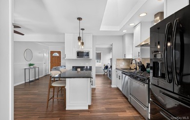 Welcome to this beautifully maintained waterfront ranch in the