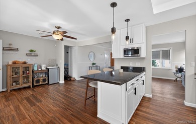 Welcome to this beautifully maintained waterfront ranch in the