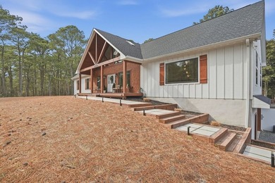 Experience refined coastal living in this architecturally - photo 3