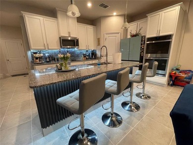 Built in 2023, this beautifully upgraded 5-bedroom, 3-bath home - photo 11