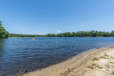 Sited privately right at the water's edge of Whitney Pond, this - photo 2