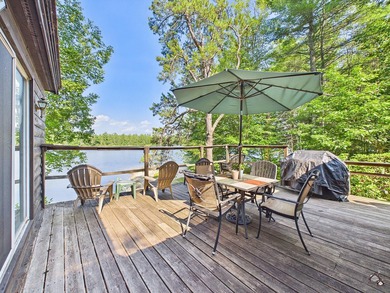 Sited privately right at the water's edge of Whitney Pond, this - photo 3