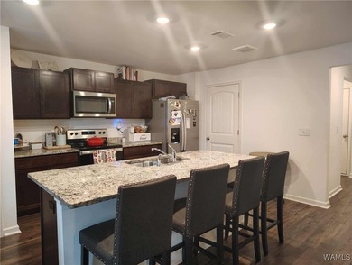 Charming 3-bedroom, 2 bath , 2 car garage home is nestled in