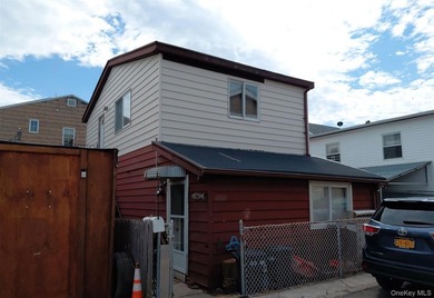 This two-story home features two bedrooms, a full bath, an - photo 1