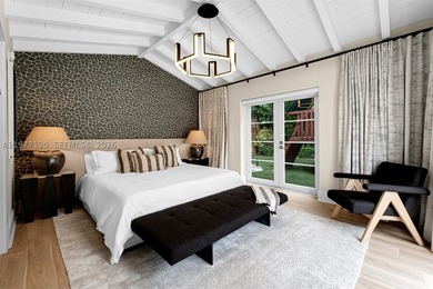 This luxurious Miami Beach estate presents a seamless blend of - photo 13