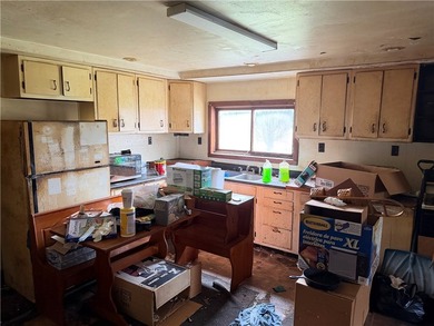 Opportunity awaits! This complete fixer-upper sits on four - photo 6