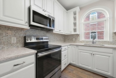 Move-in ready, two-bedroom, two-bathroom end-unit condo with - photo 12