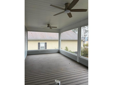 New Construction waterfront home on gently sloping lot on - photo 12