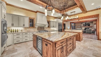 Welcome to 117 Hansma Way, a breathtaking custom ranch estate in
