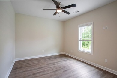 New Construction waterfront home on gently sloping lot on - photo 23