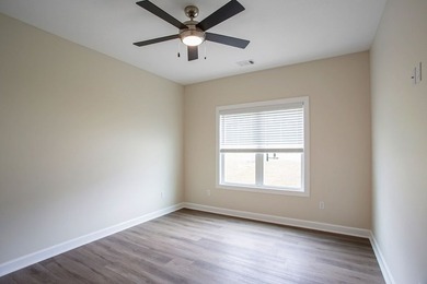 New Construction waterfront home on gently sloping lot on - photo 24