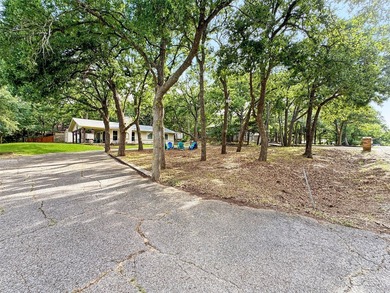 Tucked among the trees on a hillside lot in Tanglewood, this - photo 28