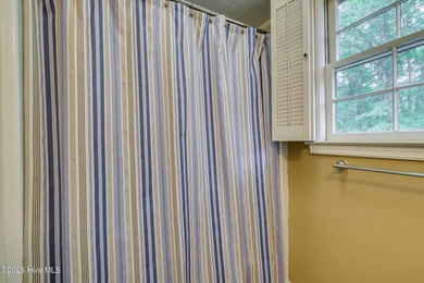 Nestled on a beautifully landscaped triple lot, this - photo 32