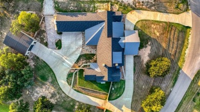 Welcome to 117 Hansma Way, a breathtaking custom ranch estate in
