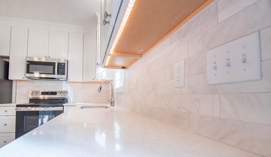 Discover modern coastal living in this stunning 3-bedroom - photo 3