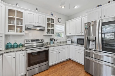 This spacious five-bedroom, four-bathroom raised beach home is