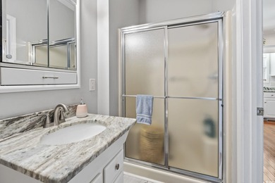 This spacious five-bedroom, four-bathroom raised beach home is