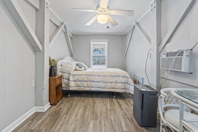 This spacious five-bedroom, four-bathroom raised beach home is