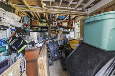 This spacious five-bedroom, four-bathroom raised beach home is