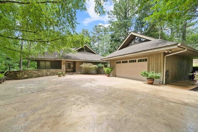 Welcome to a waterfront sanctuary nestled among the trees in the - photo 1