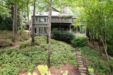 Welcome to a waterfront sanctuary nestled among the trees in the - photo 5