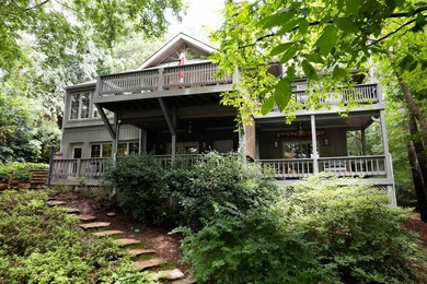 Welcome to a waterfront sanctuary nestled among the trees in the - photo 6