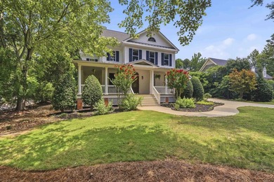 Nestled within the coveted Parkside enclave of Cuscowilla on - photo 2