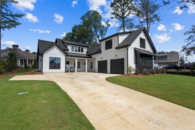 Nestled in the heart of Cuscowilla on Lake Oconee, this - photo 1