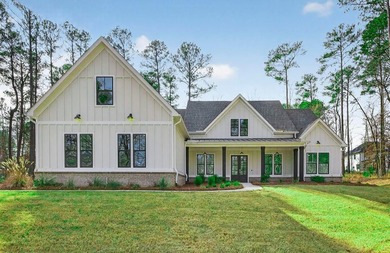Discover luxury living in Harbor Club with this stunning new - photo 1