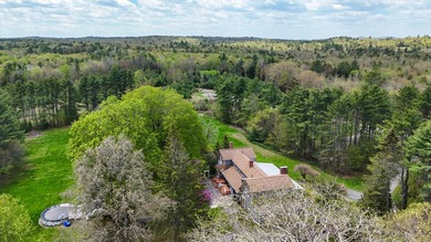 The approach sets the tone. A half-mile private road winds - photo 3