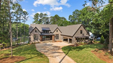 The Hearth is a waterfront home designed around the moments that - photo 1