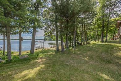 Woman Lake living begins with 150 feet of shoreline, a sandy - photo 44
