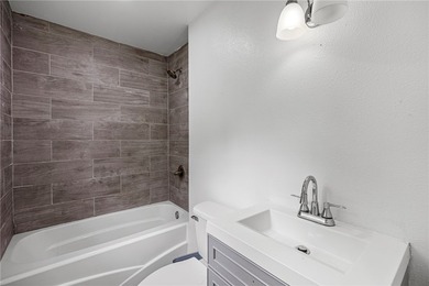 Completely remodeled and move in ready, this 4 bedroom, 3 bath - photo 31