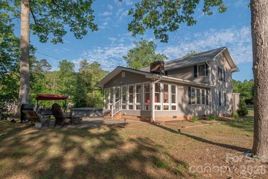 Situated along the shoreline of Badin Lake, this one-of-a-kind - photo 2