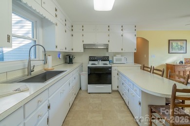 Situated along the shoreline of Badin Lake, this one-of-a-kind - photo 9