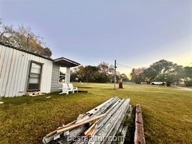 Come take a look at this waterfront lot. Has a small cabin - photo 12