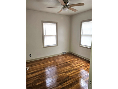 Bungalow style home on .5 acres in Saydel school system in NE