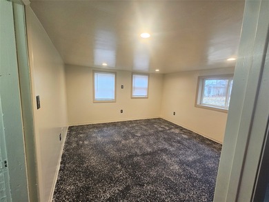 Bungalow style home on .5 acres in Saydel school system in NE