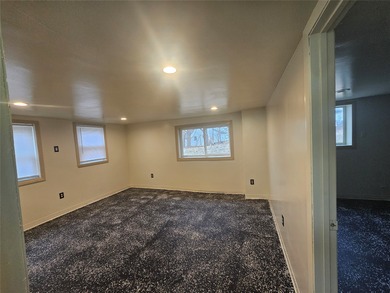 Bungalow style home on .5 acres in Saydel school system in NE