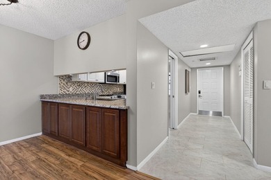 Move-in ready 2BR/2BA Palm Aire condo with expansive views. The