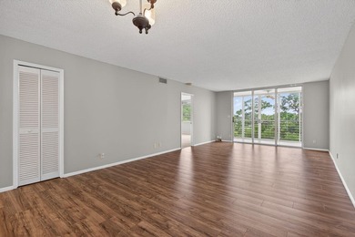 Move-in ready 2BR/2BA Palm Aire condo with expansive views. The