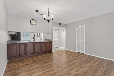 Move-in ready 2BR/2BA Palm Aire condo with expansive views. The