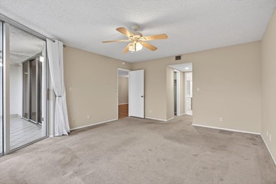 Move-in ready 2BR/2BA Palm Aire condo with expansive views. The