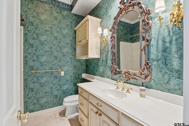 This extraordinary estate is located in the gated community of - photo 21