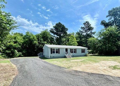 This 3-bedroom, 2-bathroom home is located on the outskirts of - photo 1